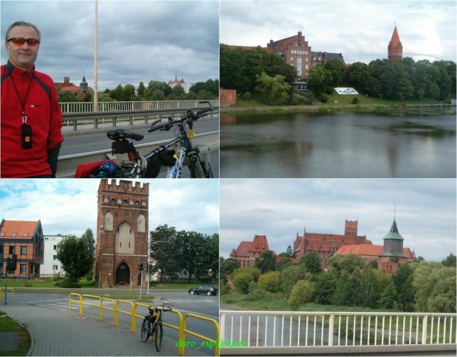 Rowerówka z Tczewa do Malborka. Widok z mostu na zamek krzyżacki i na brzeg rzeki Nogat. Baszta przy krzyżówce w centrum.
