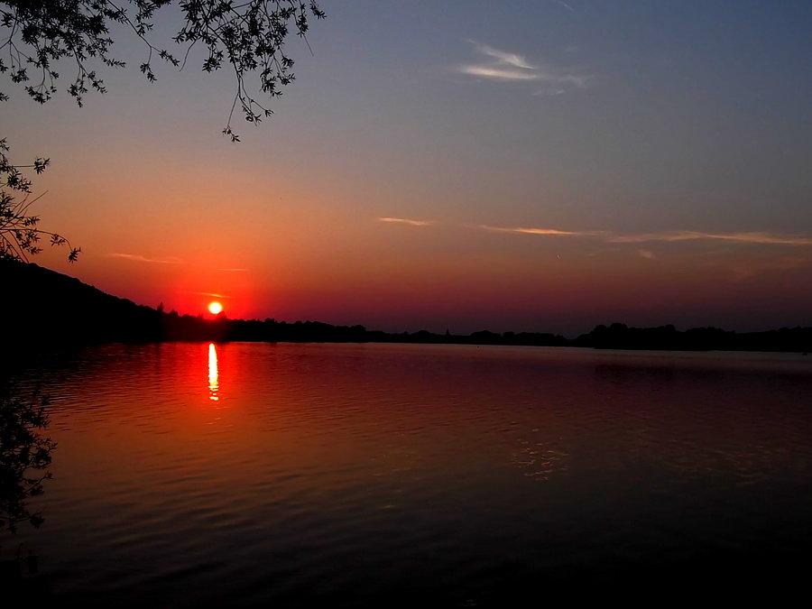 Hlučín,, zachód słońca nad jeziorem